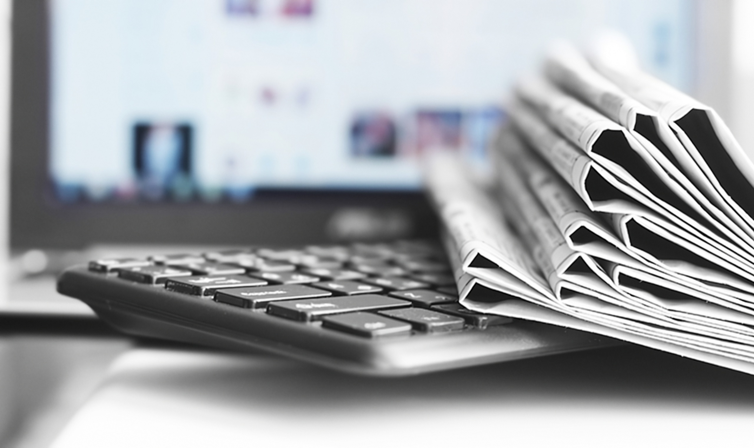 Newspapers and Laptop. Different Concepts for News - Social Network or Traditional Tabloid Journals. Data Sources - Electronic Screen of Computer or Paper Pages of Magazines, Internet or Papers